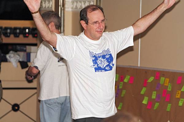 Mark Gibson, revealing the DSTC Farewell T-Shirt,  | DSTC Farewell Symposium, 28 July 2005  | 