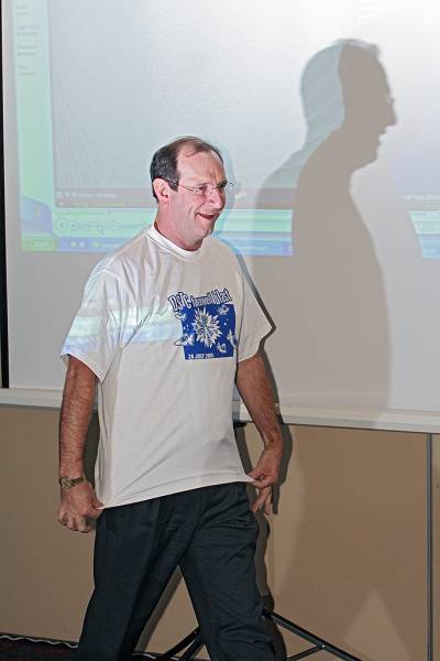 Mark Gibson, strutting his stuff in the DSTC Farewell T-Shirt,  | DSTC Farewell Symposium, 28 July 2005  | 