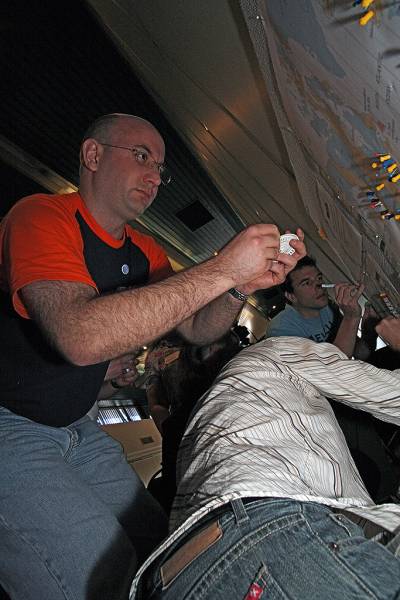 Andrew Goodchild, working on the DSTC travel map,  | DSTC Farewell Symposium, 28 July 2005  | 