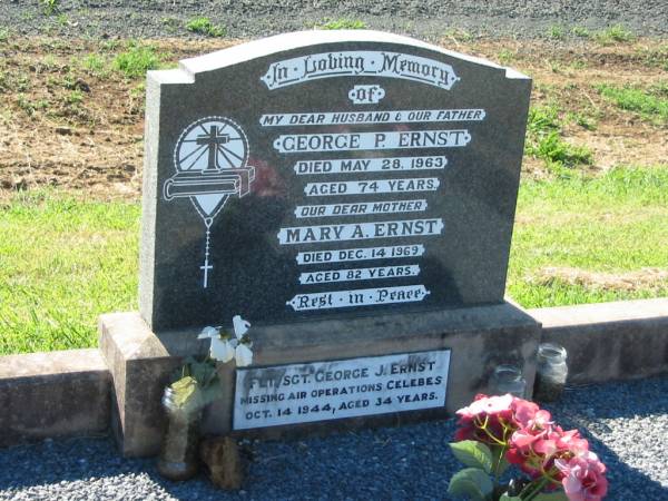 George P. ERNST, husband father,  | died 28 May 1963 aged 74 years;  | Mary A. ERNST, mother,  | died 14 Dec 1969 aged 82 years;  | George J. ERNST,  | missing air operations Celebes  | 14 Oct 1944 aged 34 years;  | Kalbar General Cemetery, Boonah Shire  | 