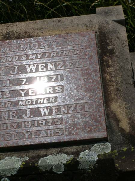 Wilhelm J. WENZEL,  | husband father,  | died 7 Jan 1971 aged 83 years;  | Wilhelmine J. WENZEL,  | mother,  | died 19 July 1975 aged 80 years;  | Milbong St Luke's Lutheran cemetery, Boonah Shire  | 