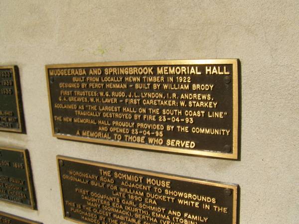 Mudgeeraba and Springbrook memorial hall. Built from locally hewn timber in 1922. Designed by Percy Henman. Built by William Brody. First trustees: W.G. Rudd, J.L.Lyndon, I.R.Andrews, G.A.Greaves, W.H.Laver. First caretaker: W.Starkey. Acclaimed as the largest hall on the south coast line. Tragically destroyed by fire 23-04-93. The new memorial hall proudly provided by the community abd opened 23-04-95. A memorial to those who served.  | Pioneers Memorial, Elsie Laver Park, Mudgeeraba  | 