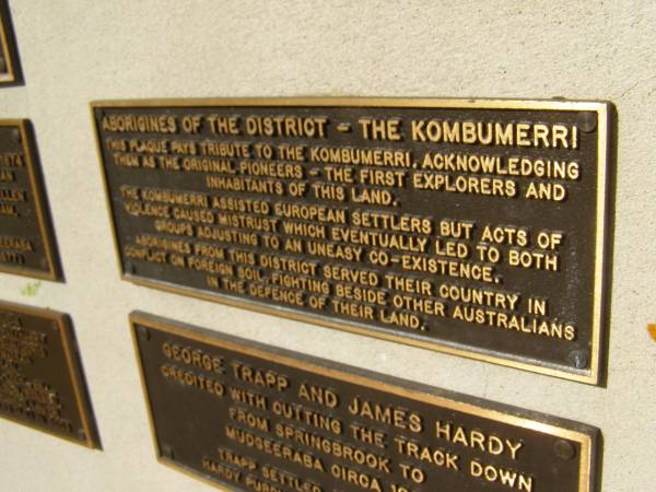 Aborigines of the district - The Kombumerri.  | (This plaque pays tribute to the Kombumerri, acknowledging them as the original pioneers - the first explorers and inhabitants of this land).  | The Kombumerri assisted European settlers but acts of violence caused mistrust which eventually led to both groups adjusting to an uneasy co-existence.  | Aborigines from this district served their country in conflict on foreign soil, fighting beside other Australians in the defence of their land.  | Pioneers Memorial, Elsie Laver Park, Mudgeeraba  | 